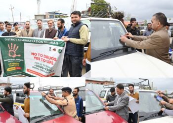 Sticker pasting, awareness drive in Shopian