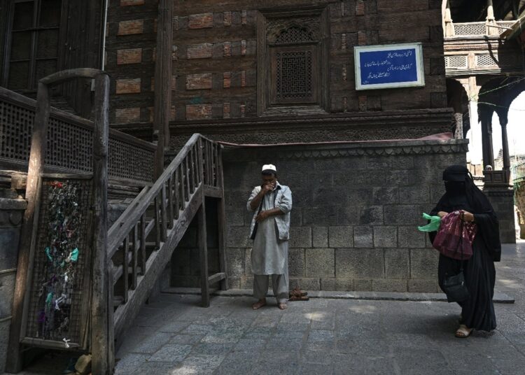Man offering prayer at Khanqah-e-Moula shrine in old Srinagar on the Urs of Hazrat Mir Syed Ali Hamadani, popularly known in Kashmir as Shah-e-Hamadan (RA)