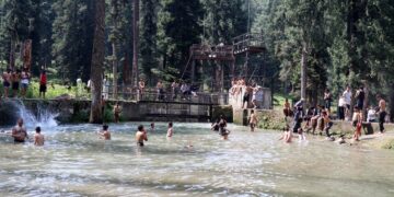 Beating the Heat: Boys taking bath in a stream at Hajan, Budgam