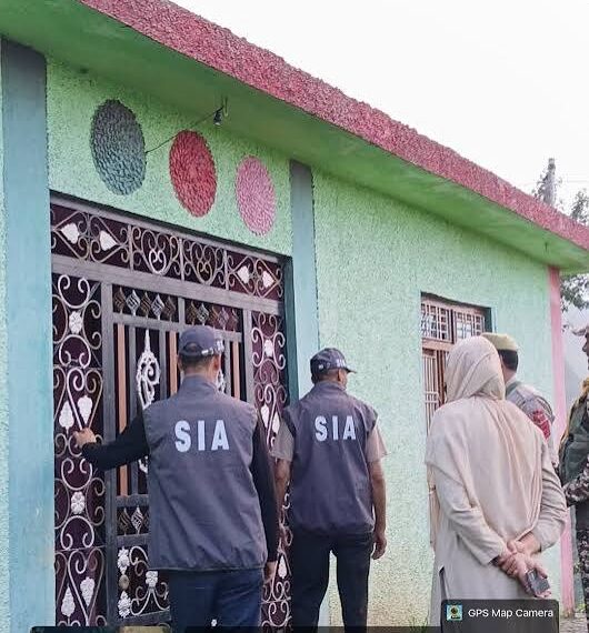 === 1990 double-murder case === SIA Kashmir searches nine locations across J&K